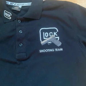 NYPD Glock Shooting Team Polo - Köpt på vintagebutik i New York, en polo som användes inom NYPD   , aldrig använt, den är baggy. 
