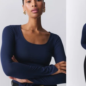 Gina soft touch toppen - Snygg mörkblå långärmad topp med rund halsringning. Perfekt för en stilren look. Tillverkad i ett mjukt och stretchigt material som ger en bekväm passform.