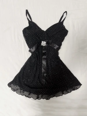 Vintage BikBok 🖤 Princess Top - Vintage BikBok Princess Top 🎀 🖤 Feminine princess/coquette/y2k 🖤 Black with tiny floral details, satin bow and rhinestone detail at the waist 🖤 If you love finding pieces nobody else has like me - this style is rare and unique  🖤 The shape is so pretty on - Perfect with lowrise jeans or a skirt 🖤 Excellent vintage condition - Barely worn  #bikbok #vintage #y2k #2000s #baddie #unique #special #coquette #alt #princess #bow #ribbon #rosett #clothes #top #fashion