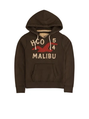 Brun hoodie med Malibu-tryck - Säljer en brun hoodie med huva och dragsnören. På bröstet står det 'HCO 54 MALIBU' i vitt och en stor röd fågel är broderad. Hoodien har en klassisk känguruficka framtill och är gjord i mjukt bomullsmaterial. Skick 9/10 inga defekter, sällsynt och eftertraktad 
