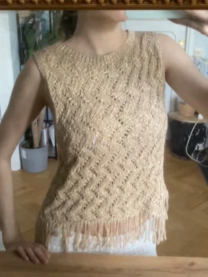 Guld topp med fransar  - Guld topp med fransar.