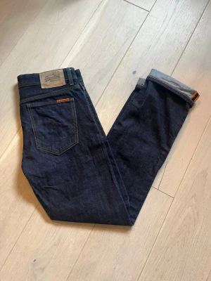 SuperDry Orange Dry Selvedge Jeans - Super Dry Orange Dry Selvedge Jeans,                 Använda fåtal gånger, säljer då de ej passar.         W:30, L:32