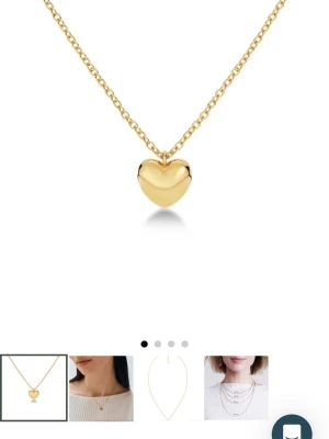 Guldigt halsband med hjärthänge - Snyggt halsband i guldfärgad metall med ett blankt hjärthänge. Kedjan är tunn och elegant, perfekt för att ge en söt touch till din outfit. Hjärtat har en mjuk, rundad form och halsbandet är enkelt att matcha med andra smycken. (Från Edblad)💗