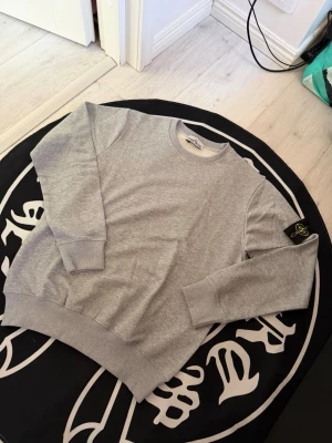 Stone island gray sweater - Size M, true to size. Very comfortable and fits nicely. Brand new