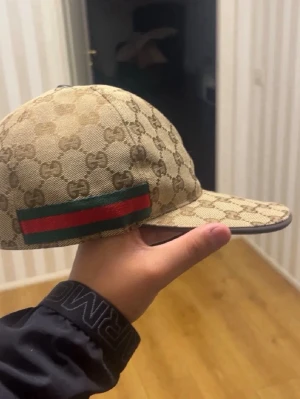 GG keps - Beige gg keps aldrig använd