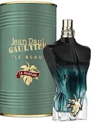 Jean Paul Gaultier Le Beau Le Parfum - En ikonisk parfym från Jean Paul Gaultier i en flaska formad som en manlig torso, med mörkblå och svarta toner samt gulddetaljer. Kommer i en elegant grön cylinderförpackning med guldtext och dekorativt lock. 50% kvar ungerfär. Pris kan diskuteras 