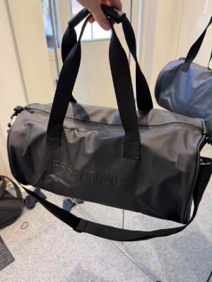 Essentials black duffle bag - Perfect for gym. Never used, in amazing condition. Ask DM for more questions and follow insta to join our giveaways!