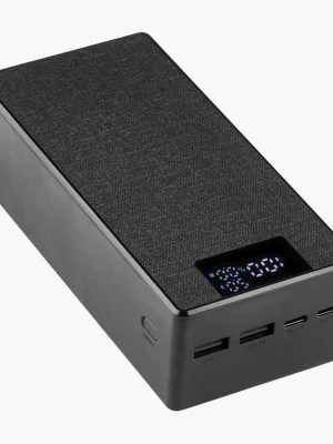 Högtalare (40K) - Stilren svart trådlös högtalare med rektangulär form och tygklädd ovansida. Utrustad med digital display och flera USB-portar på framsidan. Perfekt för att spela musik trådlöst via Bluetooth. Modern design som passar in i de flesta rum.
