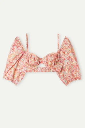 Ny croppad topp med avtagbara puffärmar Intimissimi - Nyköpt i Italien från Intimissimi. Färgglad croppad topp med blommigt mönster i rosa, orange och grönt. Toppen har puffiga avtagbara offshoulder-ärmar, smala axelband och en liten cut-out framtill. Bygelbralette tillverkad av bomullstyg med ett färgglatt kashmirtryck. Har justerbara axelband bak och avtagbara ballongärmar.