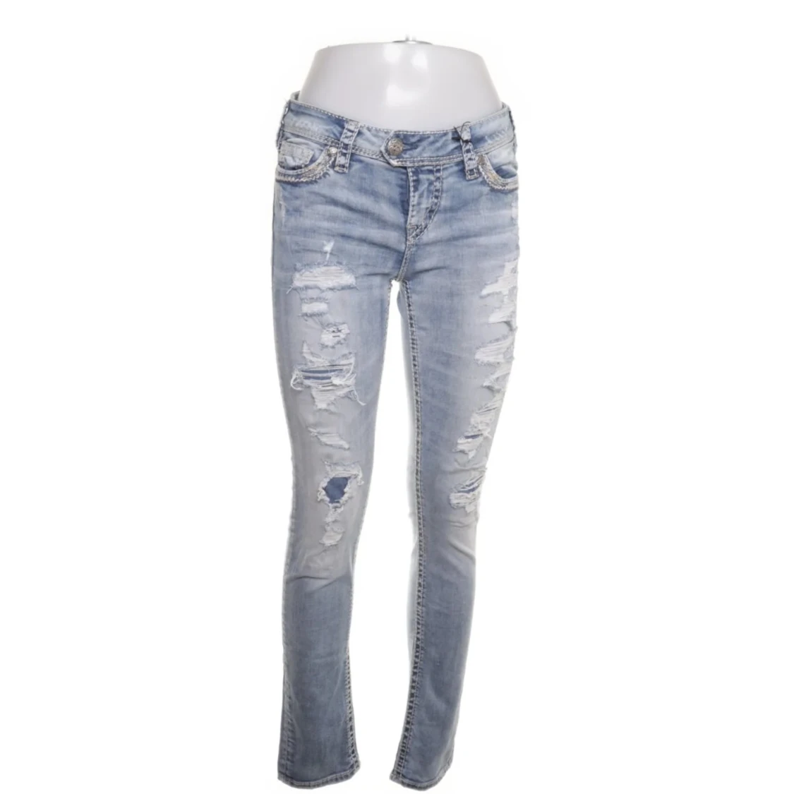 Ljusblå slitna bootcut jeans från Silver Jeans Co.