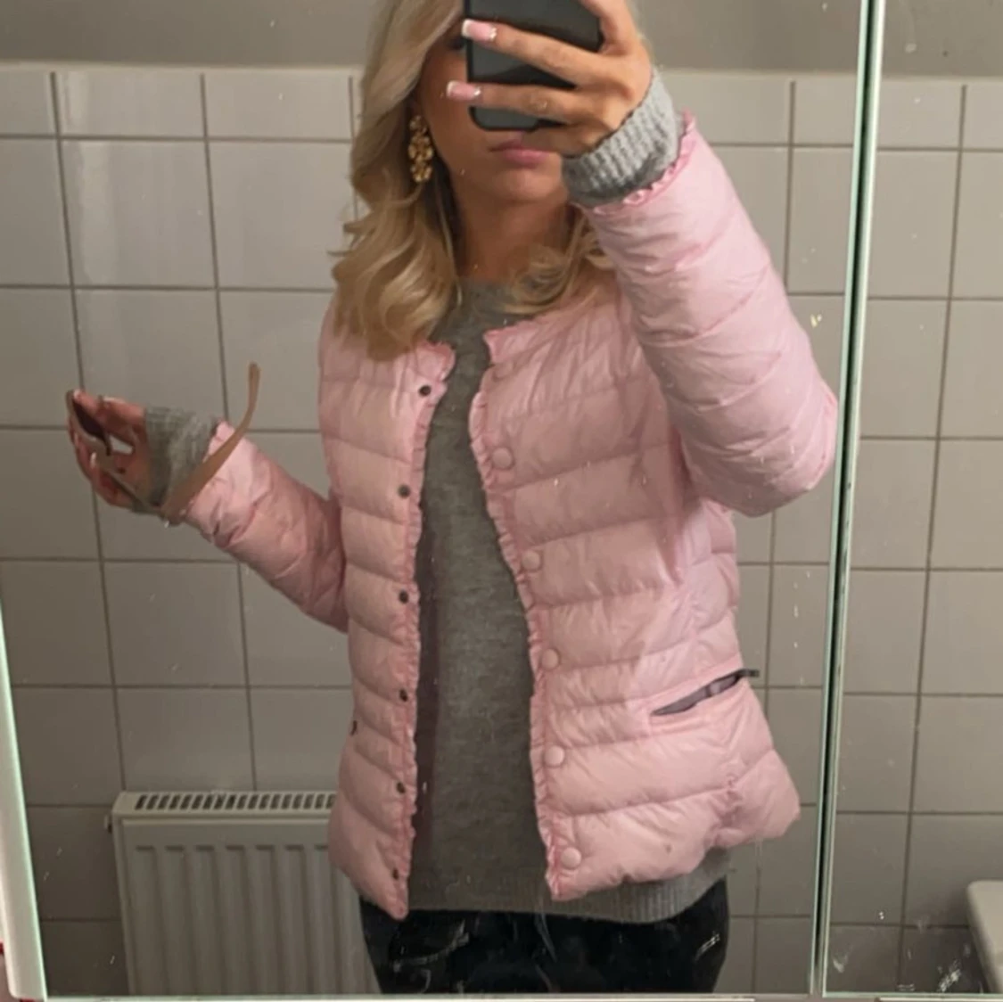 Rosa dunjacka med knappar