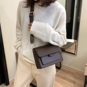 Brun axelväska i skinn - Axelremsväska, nyskick. Köpt för 299kr. Säljer för endast 150kr