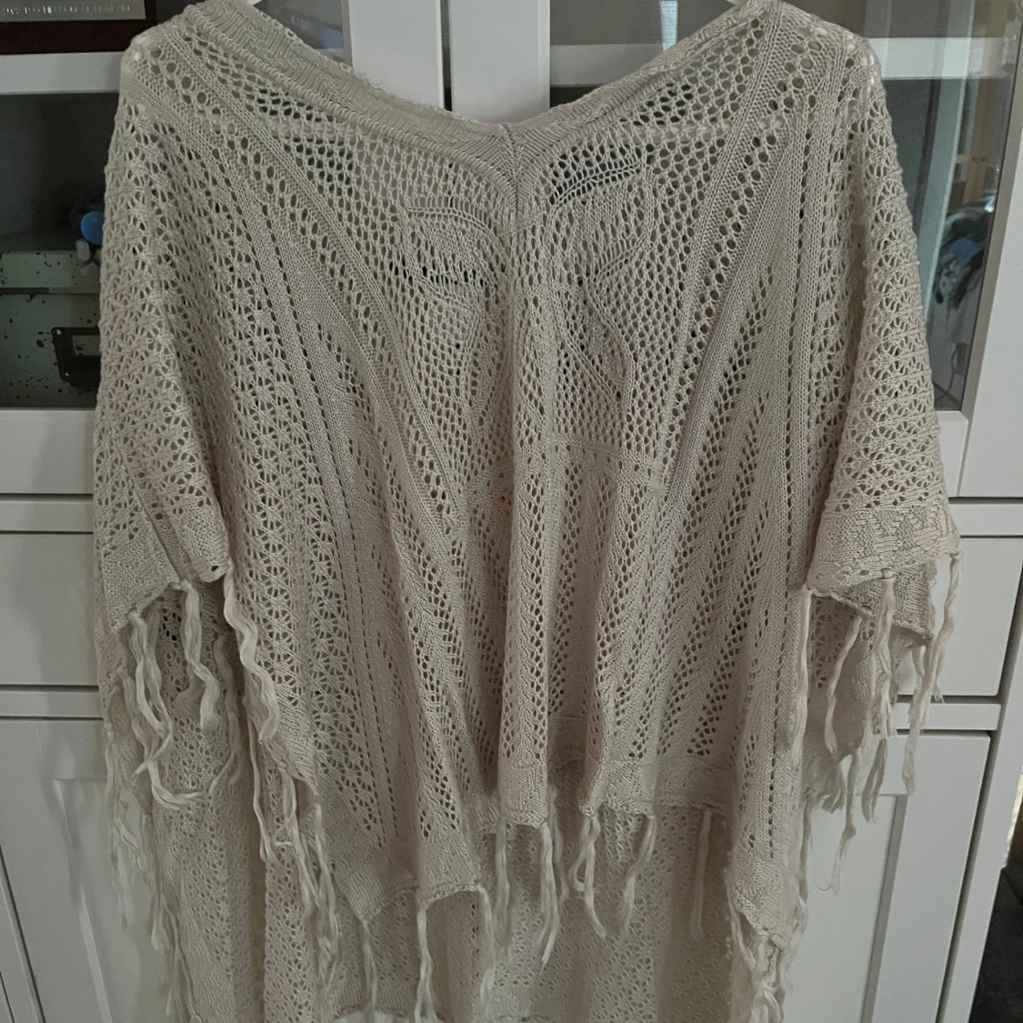Beige poncho från rosebud