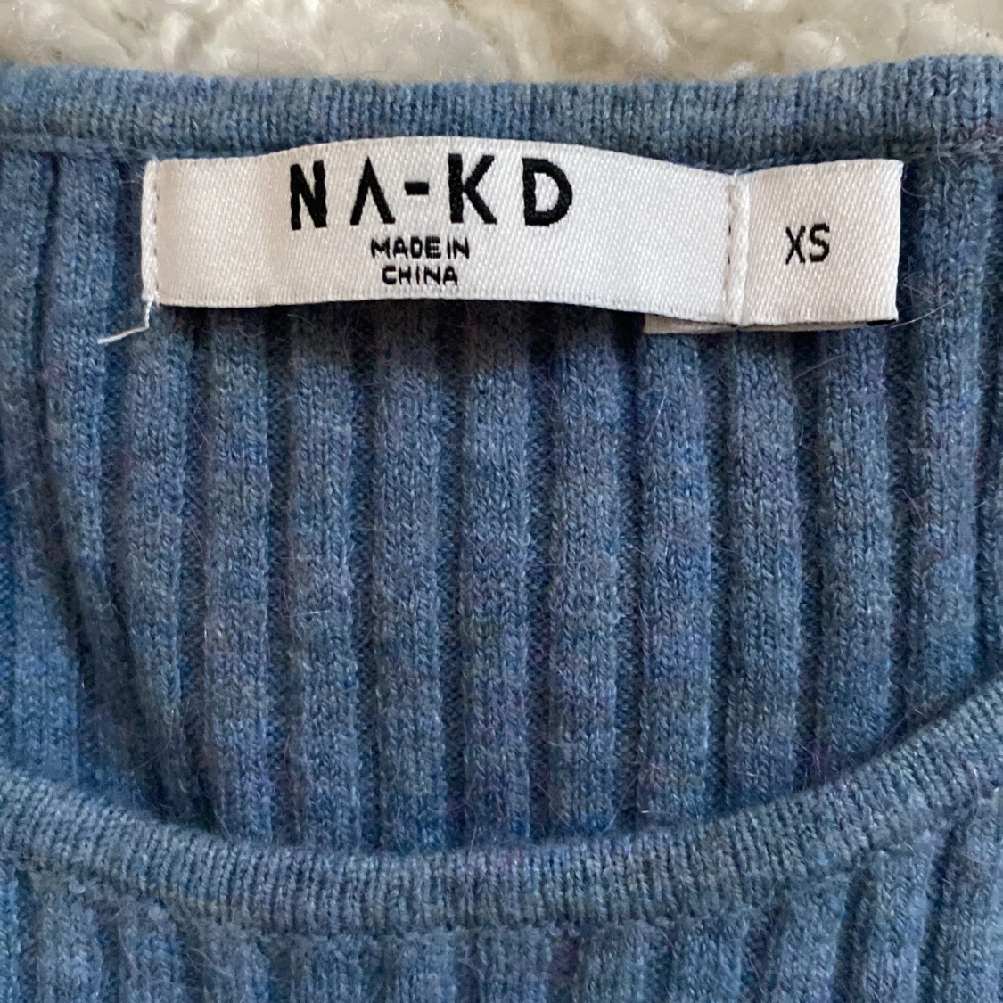 Ribbstickad topp - 91