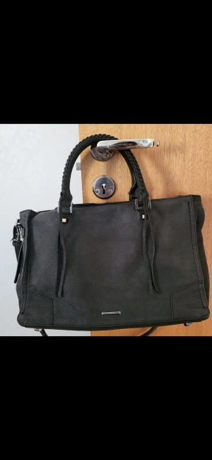 Regan Satchel Tote by Rebecca Minkoff - 22cm x 34cm x 14cm. Genuine Leather.  Used but no damages.  The strap is adjustable and detachable but is too long so I punched a few holes.
