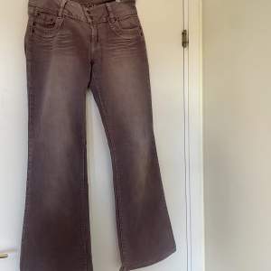 lila lågmidjade jeans 95% bomull från jane norman strl 12 motsvarar typ m/l!