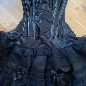 A very pretty black corset dress from Burleska. Not used much and in very good condition!