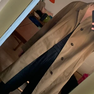 Uniqlo coat size M - Water resistant coat from Uniqlo. Sand/brown color