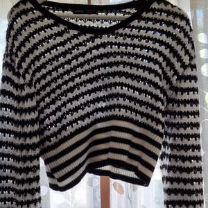 Size 38, black and white and black knitted sweater.