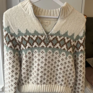 Nordic style sweater - Very gently worn. Functioning zipper, comfortable fabric, fits over a t-shirt or lighter-fabric top.  Perfect for the cooler spring months and the fall/winter, of course.  