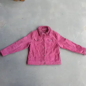 True Y2K Curdoroy jacket in this stunning hot pink color with vegan fur lining. I love the little rhinestone buttons, this jacket is so glamorous. Bimbo Dreams come true when you put it on.