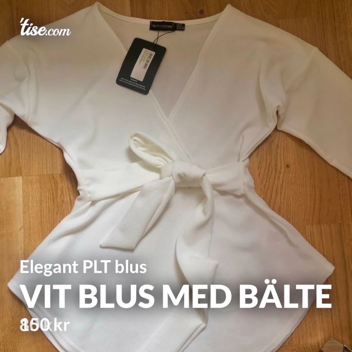 Vit blus med bälte