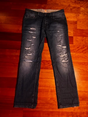 Boss Orange Jeans - Ett par vintage Boss Orange (Hugo Boss) jeans.