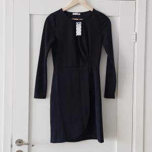 Black dress, never worn with tag attached.