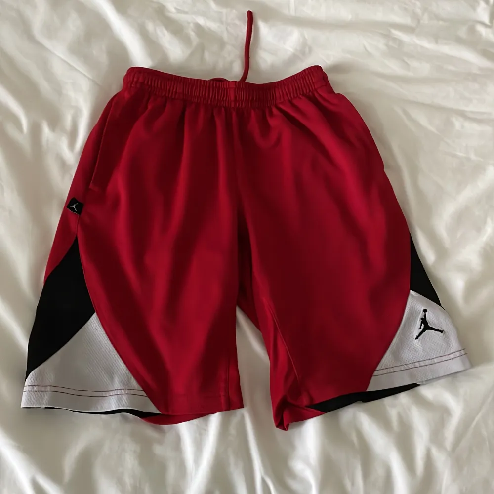 Red Jordan Basketball Shorts which are quite small. about 7 years old but in great condition. As a guy you might see your junk imprint on it if you’re over 13, but girls can wear this no problem if it fits you.. Shorts.
