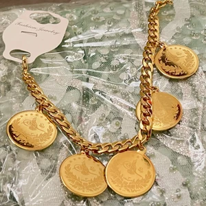 Armband/Fotsmycke - Kan användas som armband eller fotsmycke, går att justera och göra mindre/större. Helt oanvänd. 