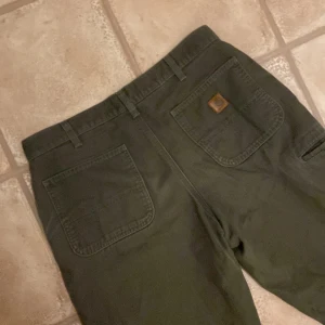 Carhartt Carpenter Grön - Säljer nu mina gamla favorit carpenters Storlek 34x34 Inga fläckar Väldigt bra skick overall Passar mig som 188 Skriv vid funderingar