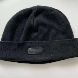 Barbour mössa  - Mössa i nyskick från trendiga märket Barbour. 