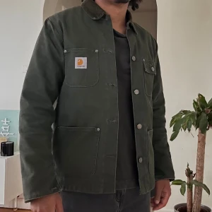 Carhartt WIP Michigan Coat - Carhartt WIP Michigan Coat Size- S 100% Organic Cotton 'Dearborn' Canvas, 12oz Sleeve Lining: 100% Nylon Striped Blanket Lining Regular Fit Triple Stitched Woven Label On Left Chest