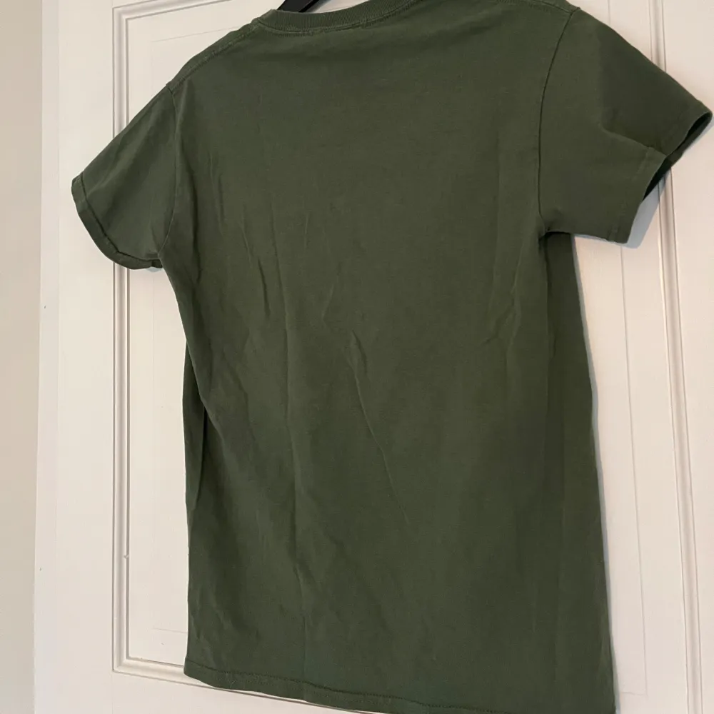 Grön Thrasher T-shirt i storlek S, i gott skick.. T-shirts.