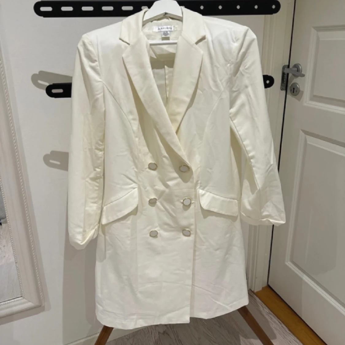 Lång creame kavaj 40