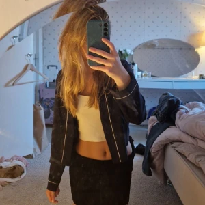 Kostymkofta  - En svart kostymkofta , använd en gång 