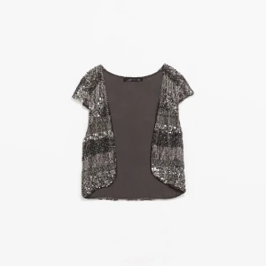Glitter bolero (ZARA) - Säljer denna superfina glitter-bolero från zara som är använd vid endast ett tillfälle. Passar superbra nu till nyår! 
