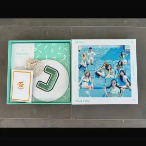 Twice Page Two album including photo cards of all members but Sana. It also comes with 3 special holographic cards of Chaeyoung, Tzuyu and Nayeon  Condition: Mint 