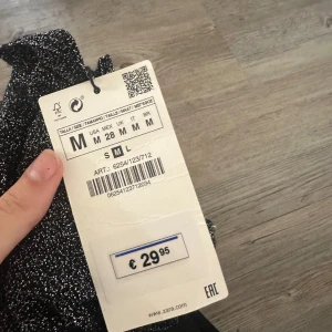 Glitter tröja - Polotröja med glitter och långa ärmar