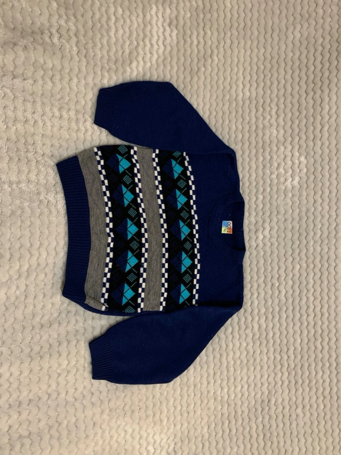 Blå stickad tröja med mönster - 1