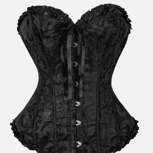 Svart korsett med rosett och mönster - Säljer en svart korsett med snyggt broderat mönster och dekorativ rosett framtill. Korsetten har snörning i ryggen, metallknappar framtill och volangdetaljer längs kanterna. Perfekt för dig som vill ha en statement piece till din outfit.