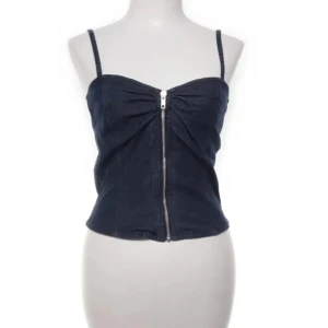 Topp hm - Snygg mörkblå korsett med smala axelband och dragkedja framtill. Perfekt för en stilren look.