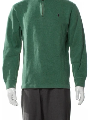 Grön tröja från Polo Ralph Lauren - Mörkgrön långärmad tröja från Polo Ralph Lauren med halv dragkedja och diskret logga på bröstet. Tillverkad i mjukt bomullsmaterial och har ribbade muddar vid ärmslut och nederkant. Perfekt för en avslappnad och stilren look.