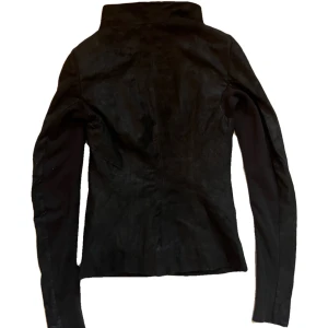 Rick Owens SS11 hammerd lamb leather jacket  - From the spring summer 2011 collection. Seen on Taylor Swift but she had the zip version.