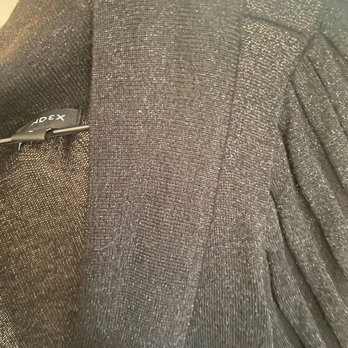 Glittrig svart kofta  - 1