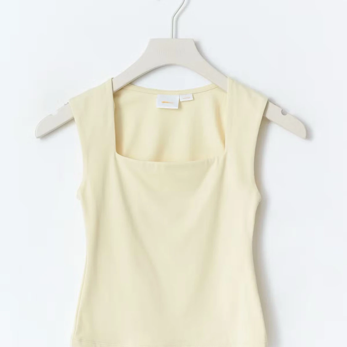 Ljusgul ärmlös linnetopp - 1