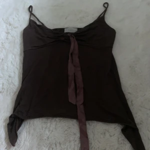 Brunt linne - Brunt linne med band från ciocco, strl står ej skulle gissa XS/S. Bra skick. 