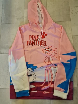 Hoodie Rosa Pantern - Hoodie Rosa Pantern. Trendig vardaglig långärmad hoodie-tröja för män och kvinnor med 3D rosa tecknat tryck. Perfekt för utomhusaktiviteter, med dragsko och känguruficka. Denna vardagliga långärmade sporttröja passar för vår och höst.