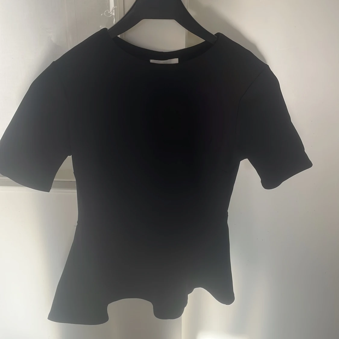 Svart peplum topp från H&M XS