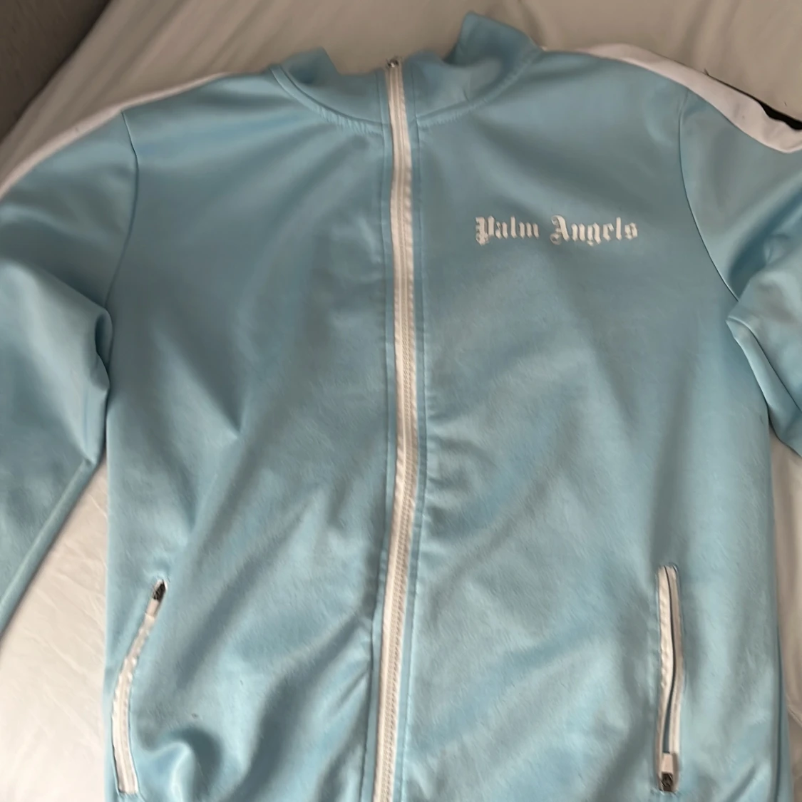 Ljusblå trackjacka från Palm Angels